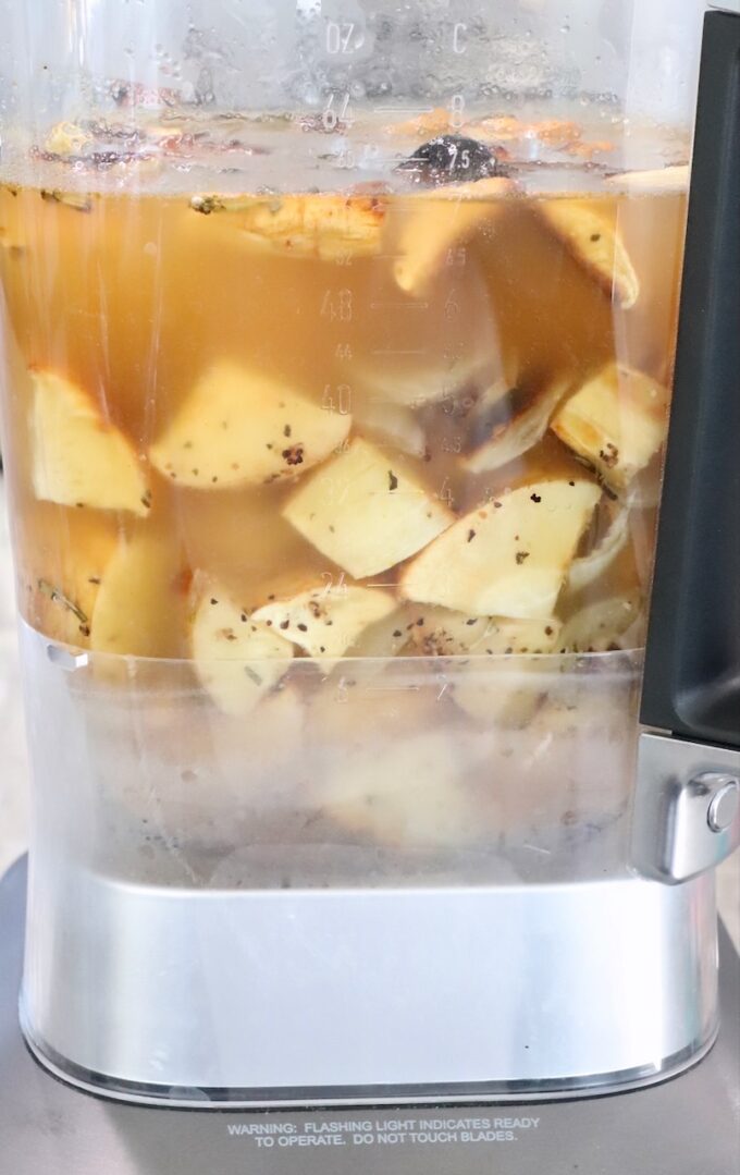 diced roasted parsnips and vegetable broth in a blender