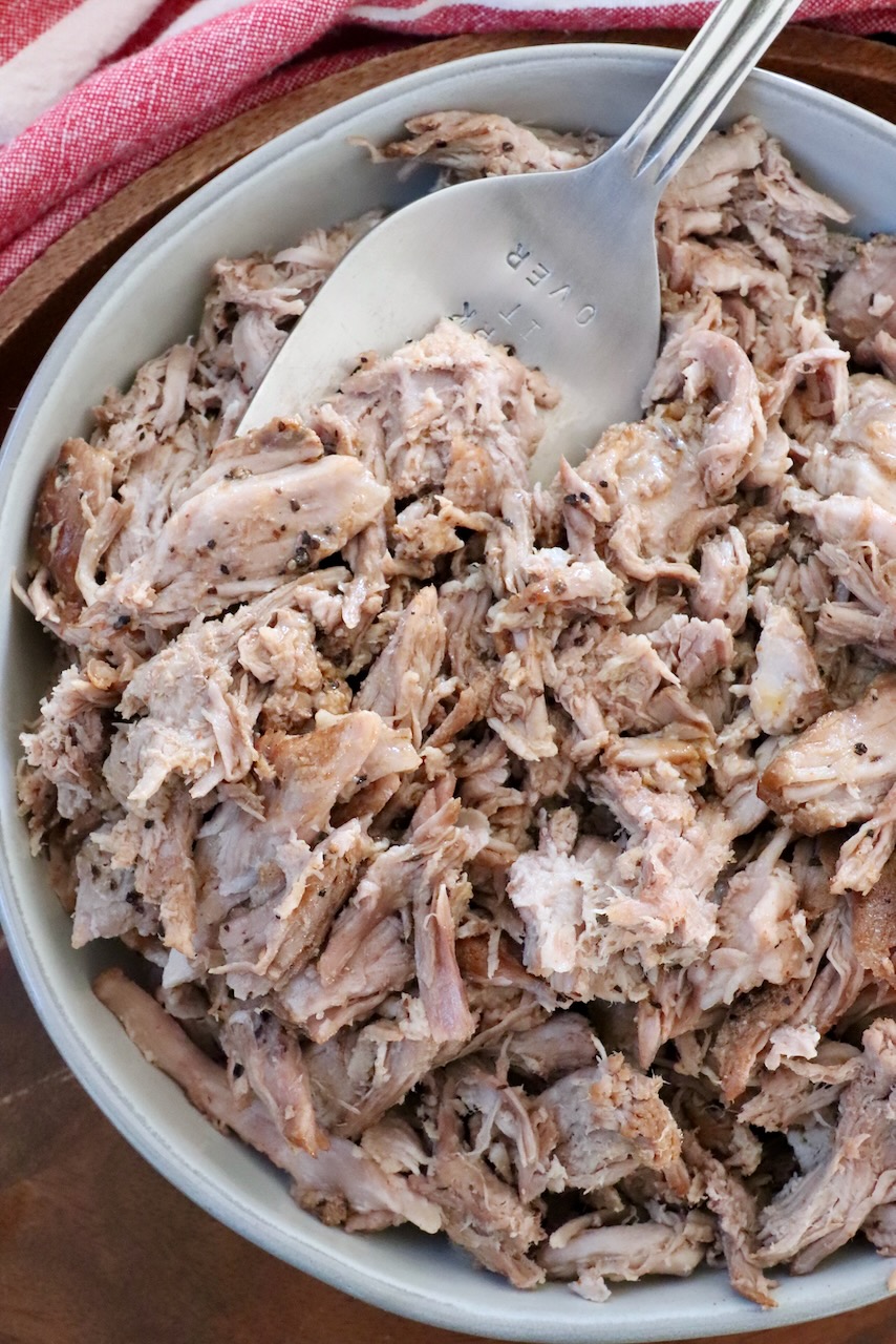 pulled pork in bowl with large serving fork