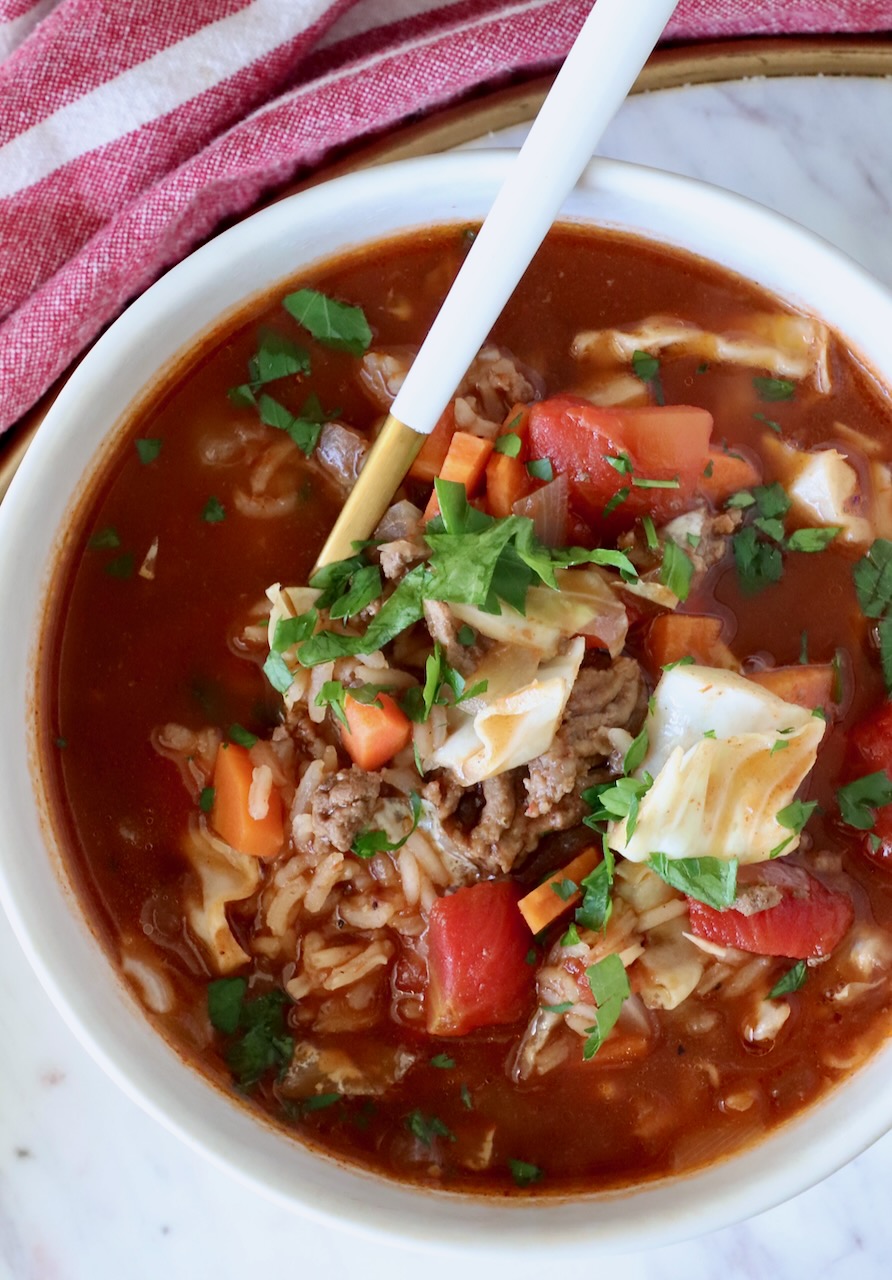 cabbage roll soup in a bowl with a spoon