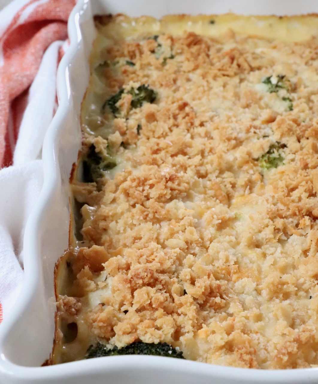 baked casserole with a crunchy cracker topping in a white baking dish