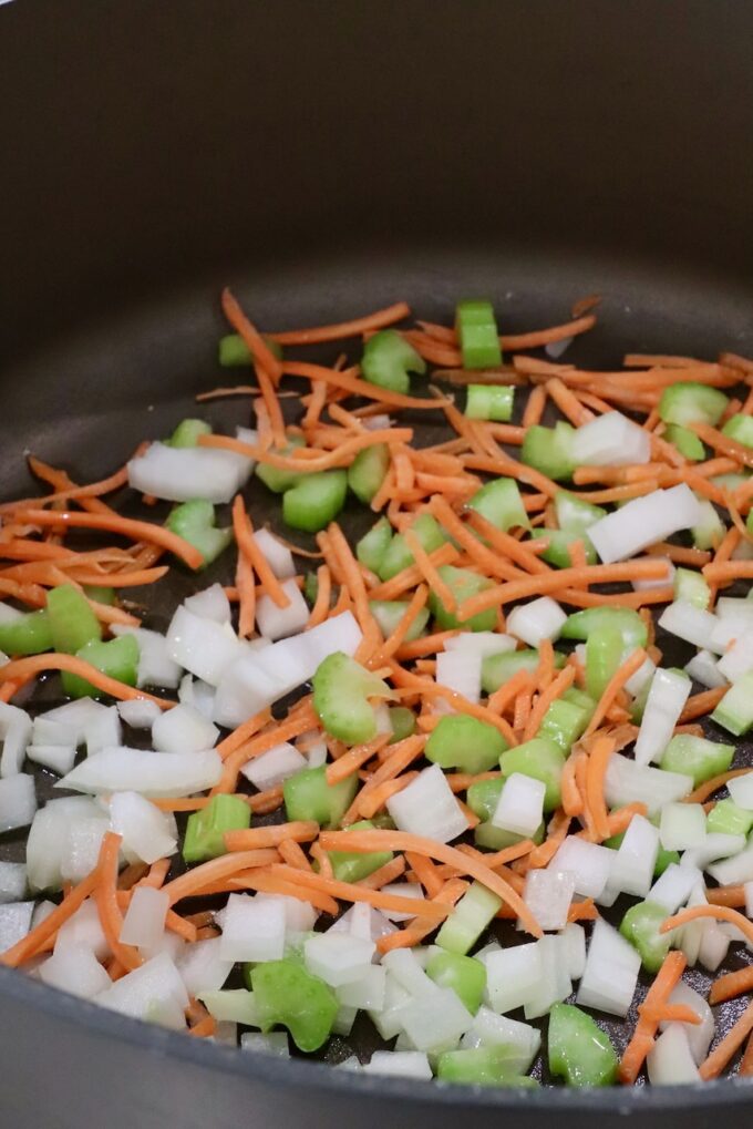 diced onions, celery and shredded carrots in a large pot