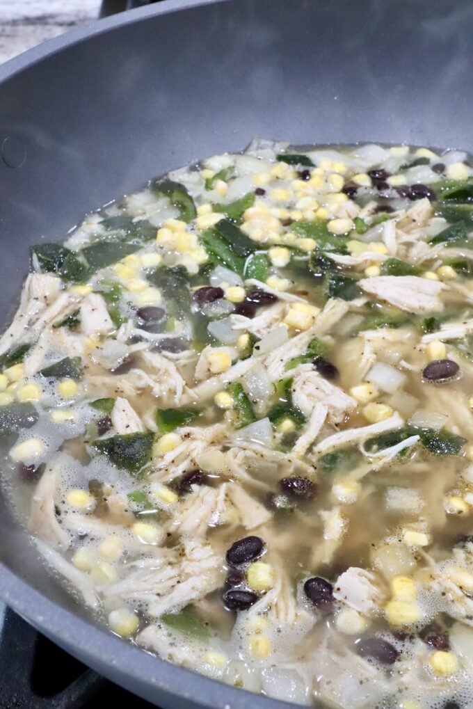 chicken poblano soup in a large pot on the stove