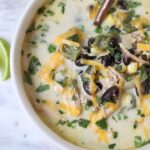 chicken poblano soup in a bowl with a spoon