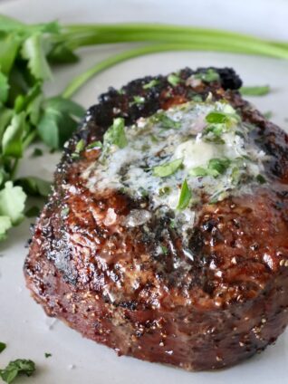 cooked filet mignon on a plate with
