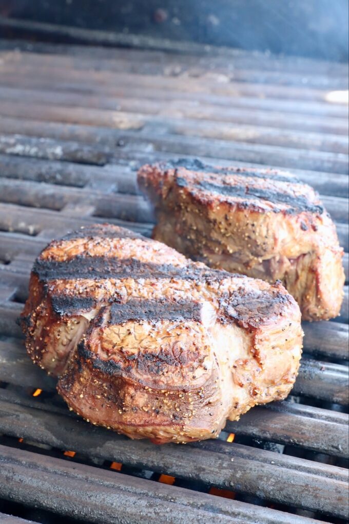 seared filet mignon steaks on a grill