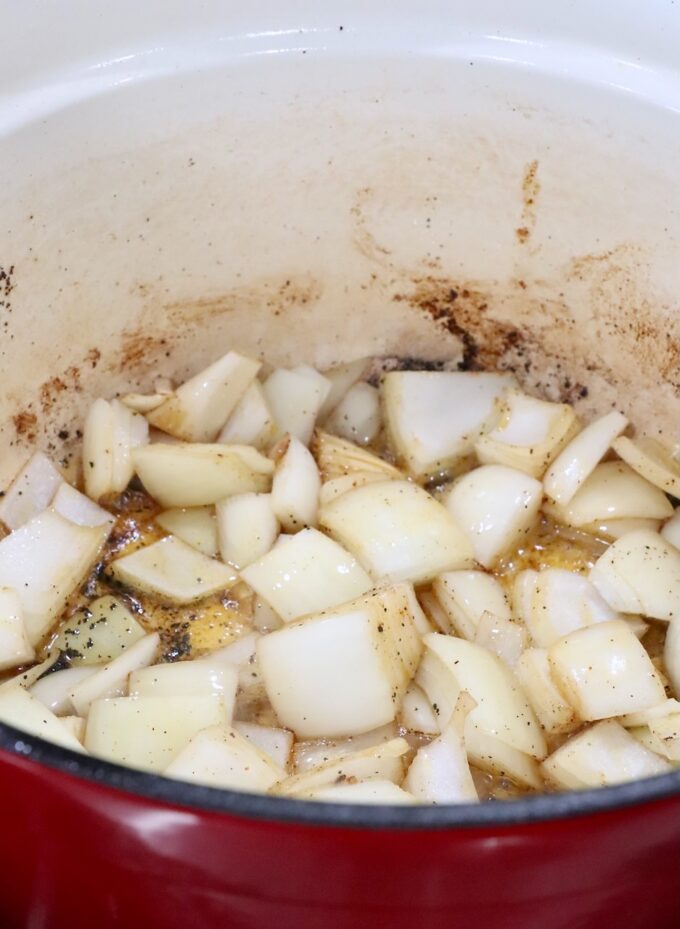 large diced onions in a large cast iron pot