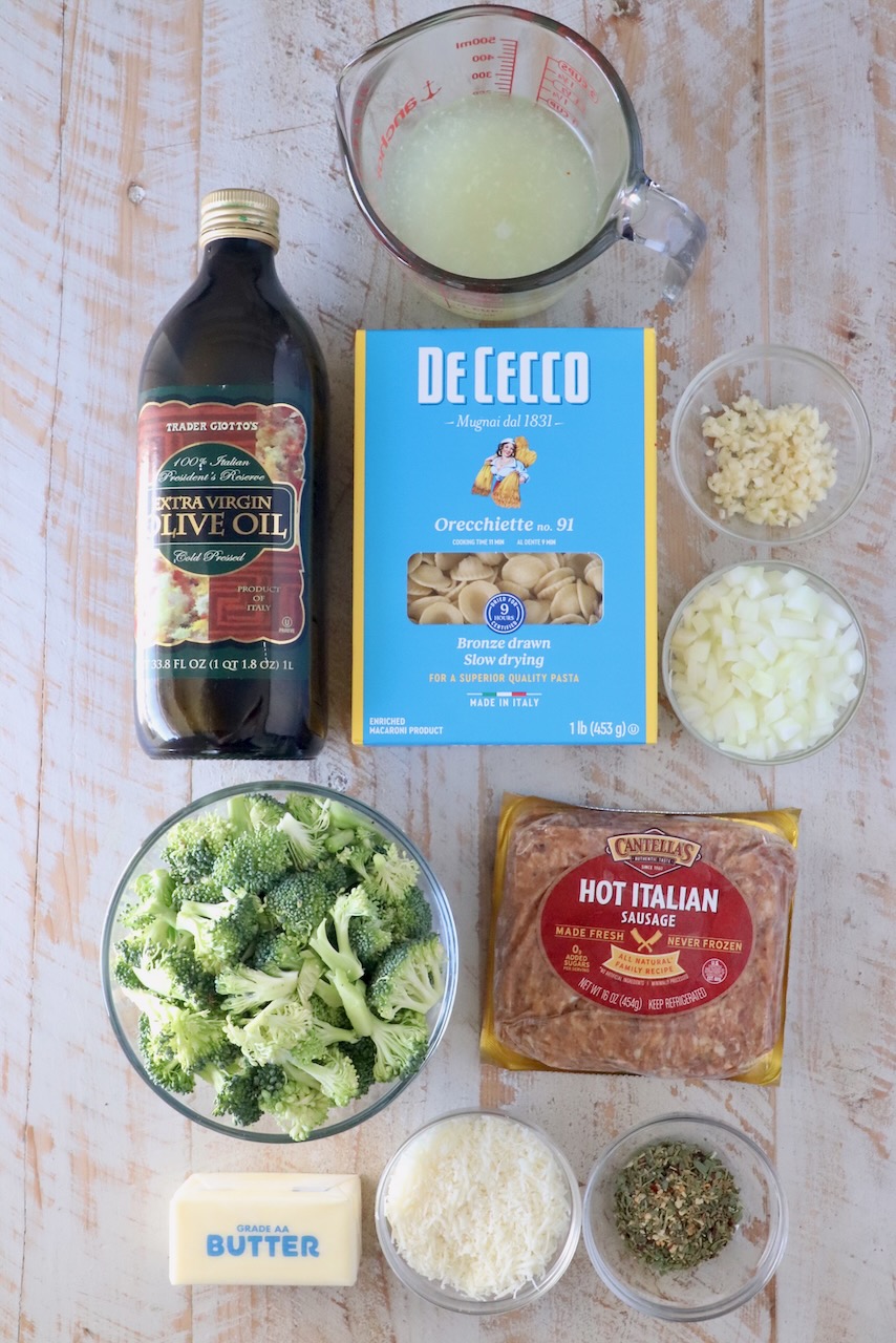 ingredients for orecchiette pasta recipe on a white wood board