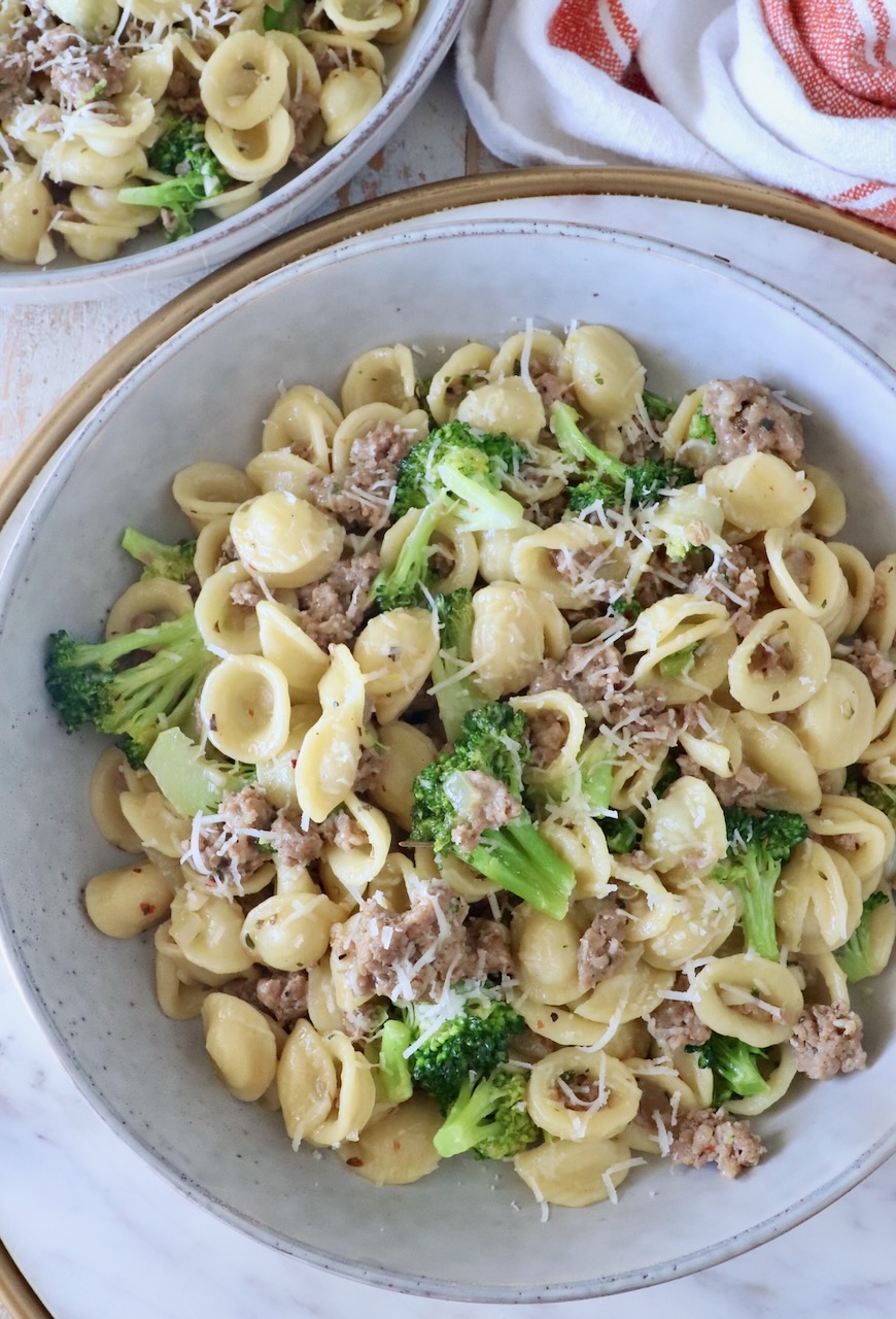 cooked orecchiette pasta with broccoli and Italian sausage in a bowl