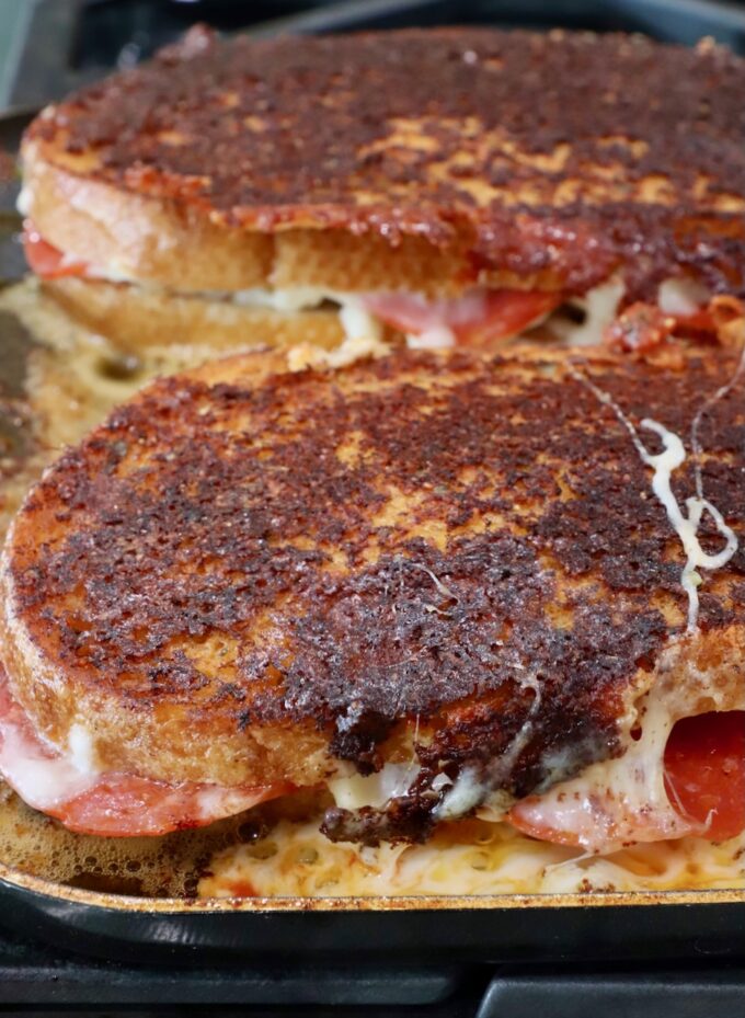 toasted pizza grilled cheese sandwiches in a skillet