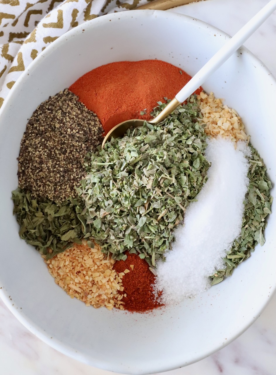 spices separated in a bowl with a spoon