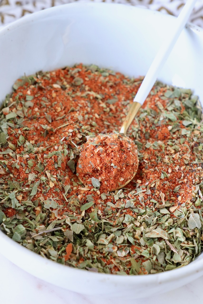 pizza seasoning in a bowl with a small spoon