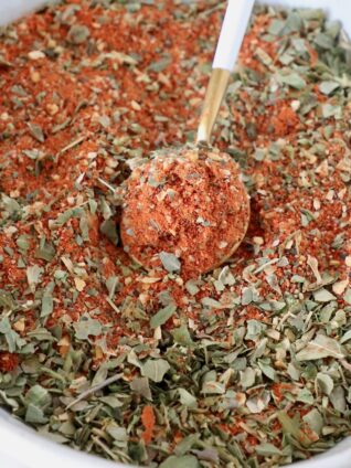 pizza seasoning in a bowl with a spoon