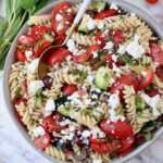 pasta salad in a bowl with a spoon