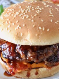 prepared burger on a plate with korean bbq sauce