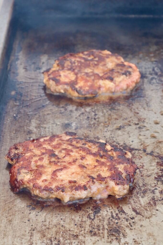 grilled burger patties on a griddle