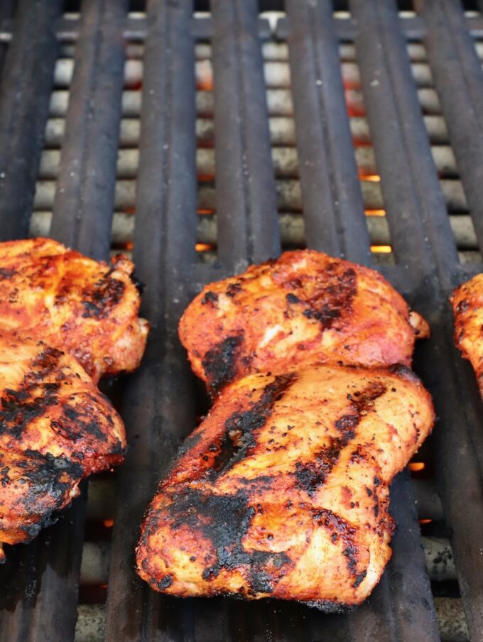 grilled chicken thighs on a grill