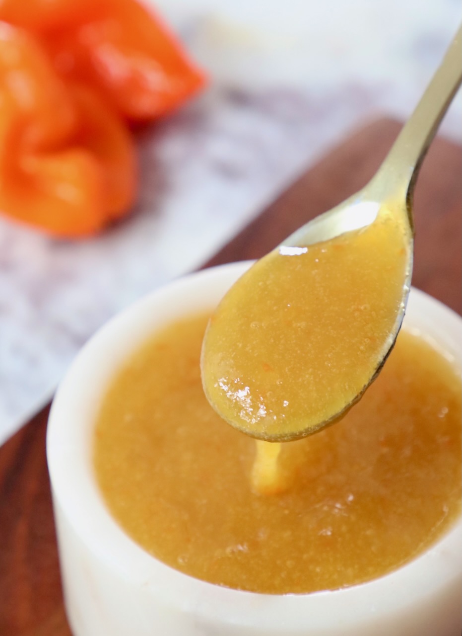 mango habanero sauce in spoon and in small bowl
