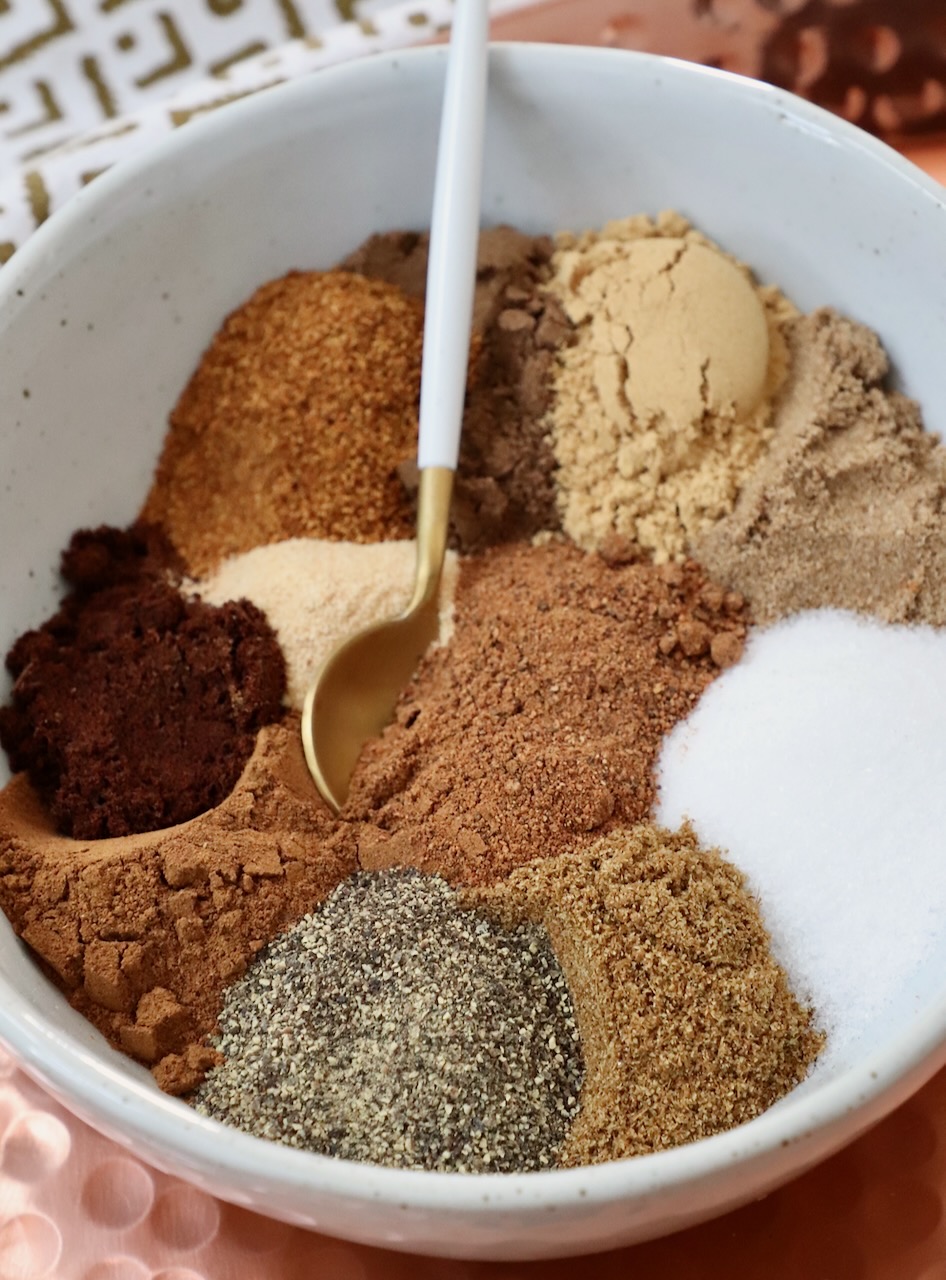 spices separated in a bowl with a small spoon