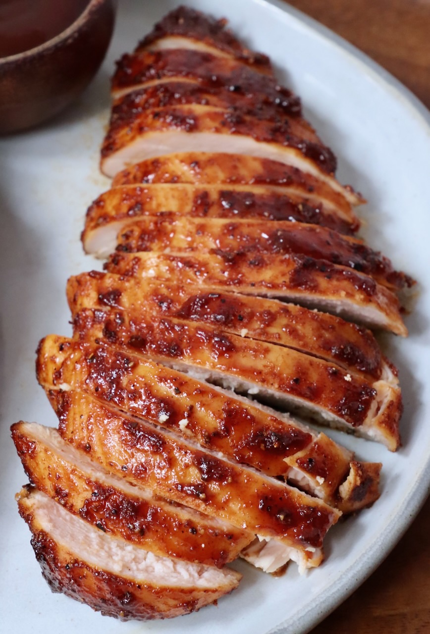 sliced smoked chicken breast on a plate