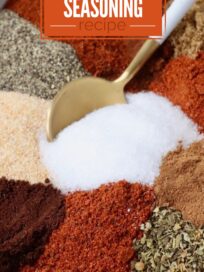 dried herbs and spices separated in a bowl with a spoon