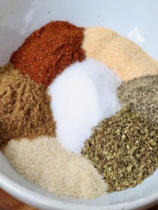 dried herbs and spices separated in a bowl