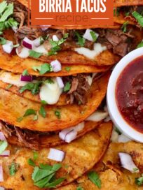 quesabirria tacos stacked up on a plate with a small bowl of consomme on the side