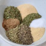 dried herbs and spices separated in a bowl