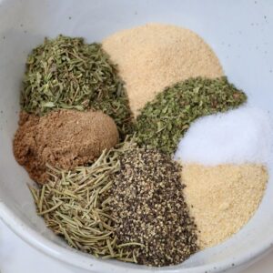 dried herbs and spices separated in a bowl