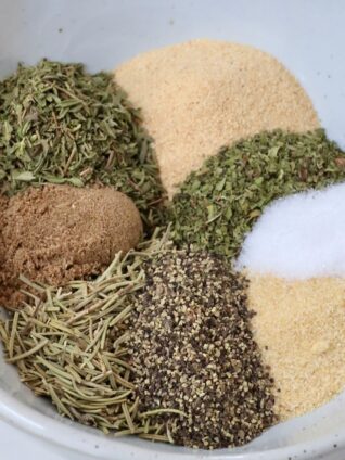 dried herbs and spices separated in a bowl