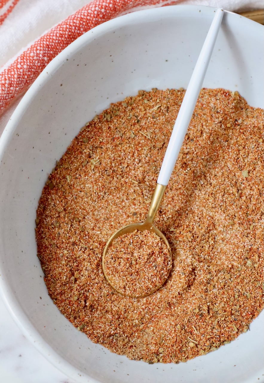 spices stirred together in a bowl with a small spoon