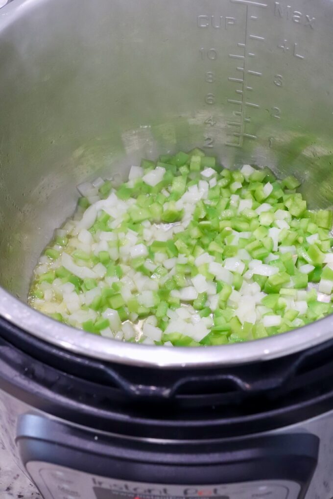 diced onion and diced green bell pepper in an Instant Pot