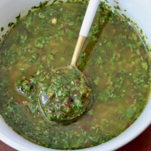 cilantro chimichurri sauce in bowl with spoon