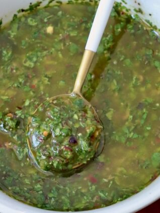 cilantro chimichurri sauce in bowl with spoon