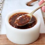 general tso sauce in a small bowl with a spoon