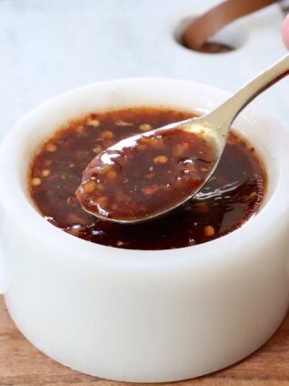 general tso sauce in a small bowl with a spoon