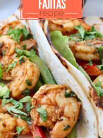 shrimp fajitas in tortillas on a plate