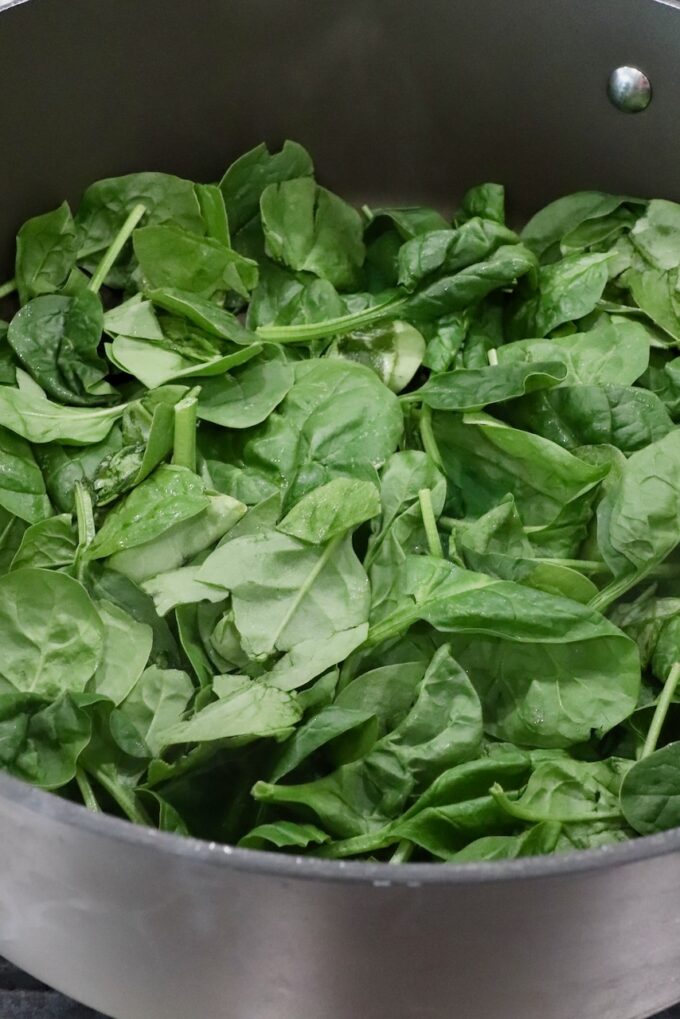 spinach leaves in a large pan
