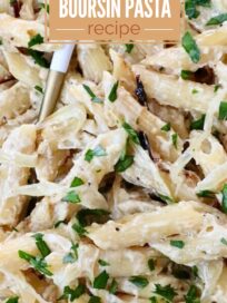 Creamy pasta dish covered in golden-brown onions and fresh herbs. Text overlay reads "6 Ingredient French Onion Boursin Pasta Recipe."