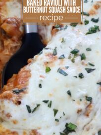 Close-up of baked ravioli topped with melted cheese and herbs, served with butternut squash sauce. A label reads "Easy Dinner Idea" above the dish.
