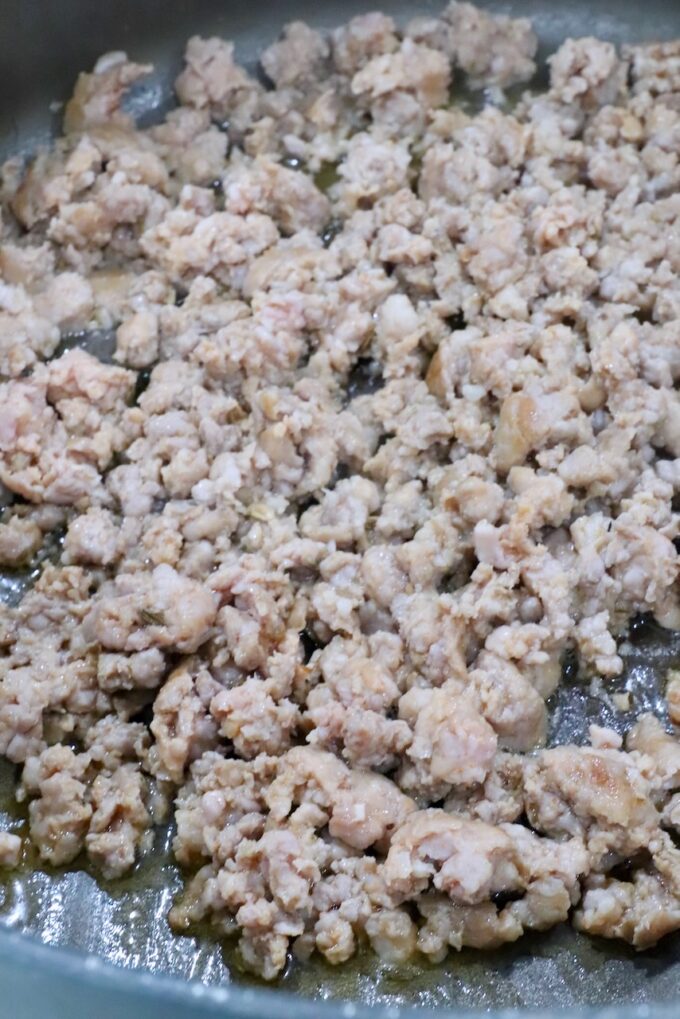 cooked, crumbled sausage in a large pot