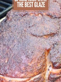 Close-up of a double-smoked spiral ham with a rich, brown glaze on a smoker. The text overlay reads, "Double Smoked Spiral Ham with the Best Glaze."