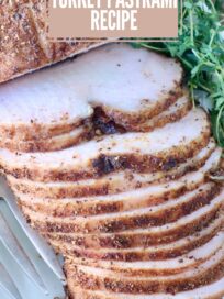 Sliced turkey pastrami on a white plate with herbs. Text overlay reads "Easy Homemade Turkey Pastrami Recipe."