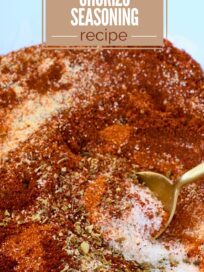 A mix of vibrant red and brown spices with a golden spoon in a bowl, featuring the text "Easy Homemade Chorizo Seasoning Recipe" at the top.