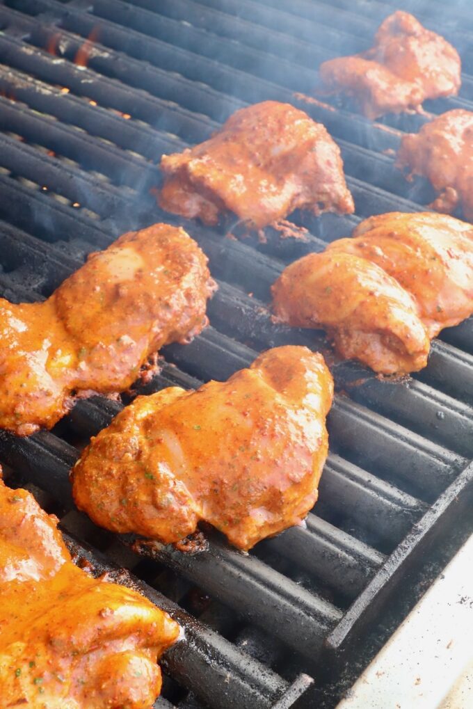 marinated chicken thighs on a grill